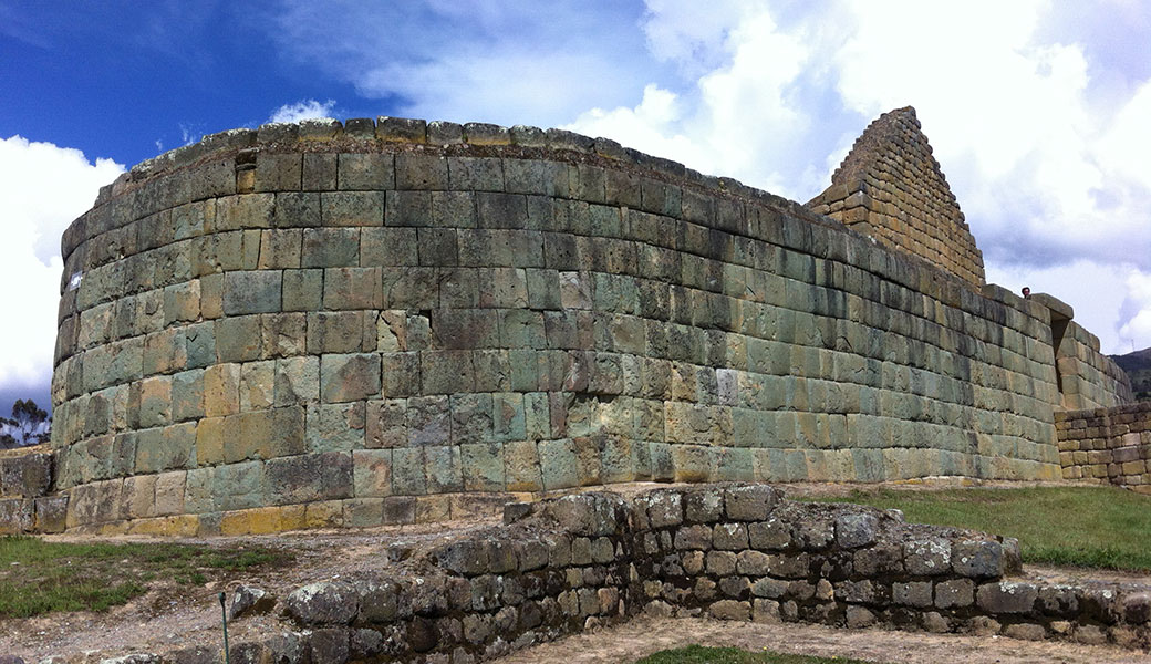Rounded Inca stone wall, part of Inca temple in Ingaprica Ruins, Ecuador