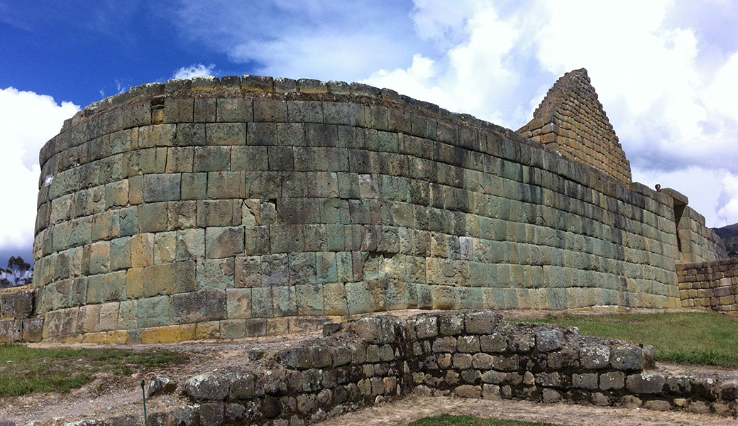 Rounded Inca stone wall, part of Inca temple in Ingaprica Ruins, Ecuador